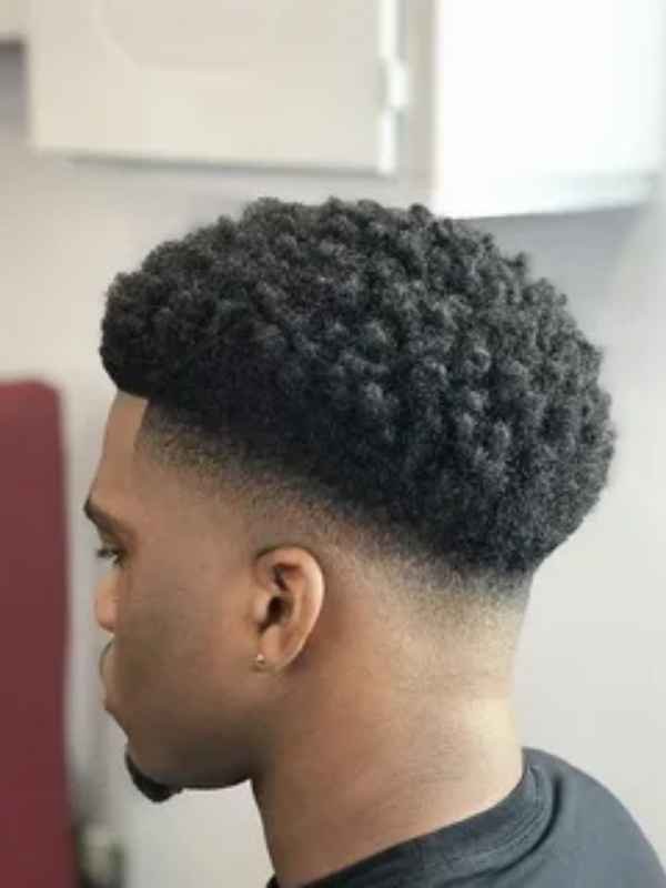 Low Afro with Mid Taper Fade.